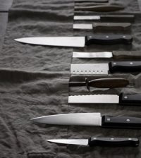 knives on a black desk