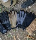 a lot of different types of field gloves on the ground